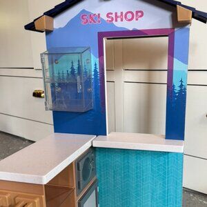 American Girl Doll 2022 Corinne's Ski and Snack Shop, fireplace and bench